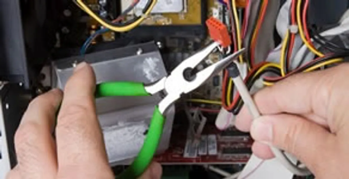 Licensed electrical contractor performing electrical repair with tools in Randolph A F B, TX
